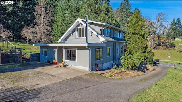 view of property exterior featuring central AC