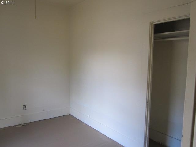 1725 SE Mill St, Roseburg, OR 97470 - unfurnished bedroom featuring concrete flooring