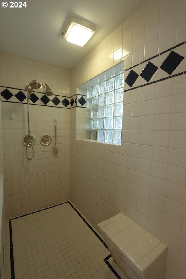 bathroom with tiled shower