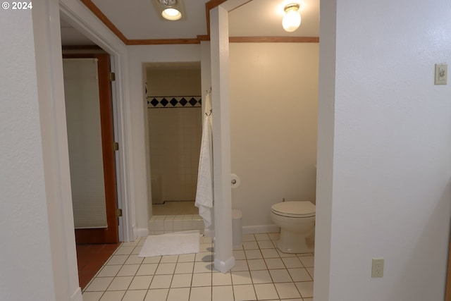 bathroom with tile patterned floors, curtained shower, toilet, and crown molding