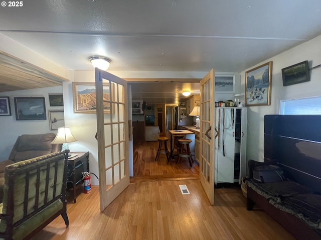 34360 NE Colorado Lake Dr Unit 996, Corvallis, OR 97333 - corridor featuring light wood finished floors and french doors