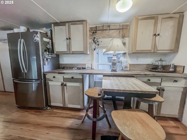 34360 NE Colorado Lake Dr Unit 996, Corvallis, OR 97333 - kitchen with freestanding refrigerator and wood finished floors
