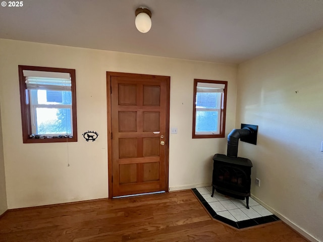 3715 Coho Pl, Cannon Beach, OR 97110 - foyer entrance featuring a wood stove and light wood-style floors