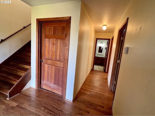 3715 Coho Pl, Cannon Beach, OR 97110 - hallway with wood finished floors, stairway, and baseboards