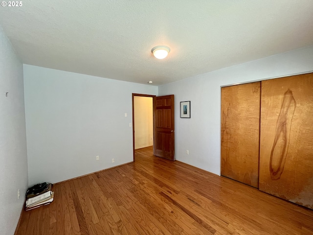 3715 Coho Pl, Cannon Beach, OR 97110 - unfurnished bedroom with wood finished floors and a closet