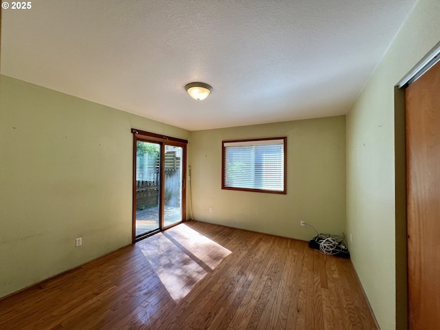 3715 Coho Pl, Cannon Beach, OR 97110 - empty room featuring hardwood / wood-style flooring and a textured ceiling