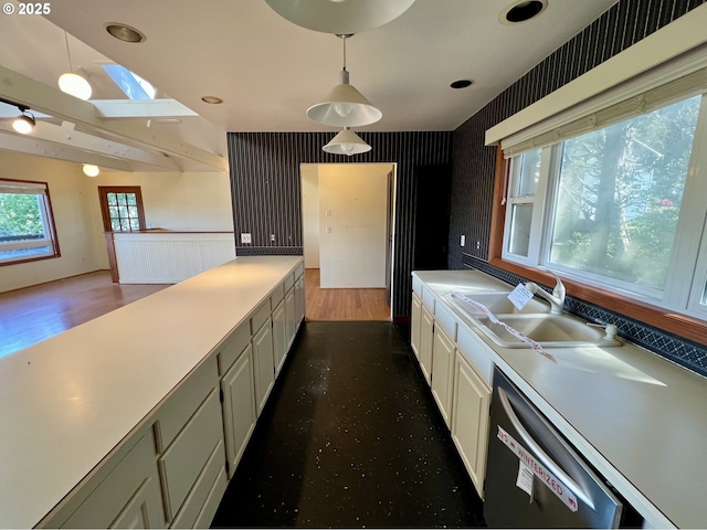 3715 Coho Pl, Cannon Beach, OR 97110 - kitchen with a sink, a skylight, dishwasher, white cabinets, and light countertops