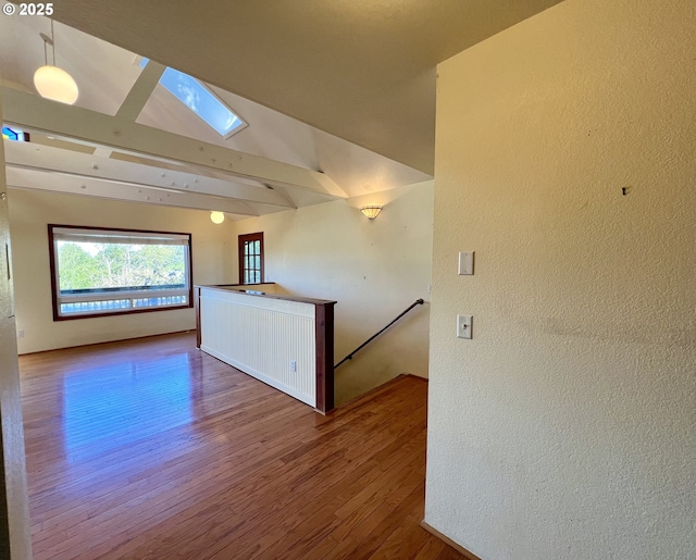 3715 Coho Pl, Cannon Beach, OR 97110 - unfurnished room featuring a skylight, wood finished floors, and a textured wall