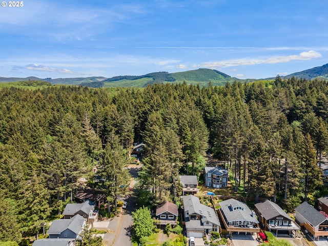 3715 Coho Pl, Cannon Beach, OR 97110 - aerial perspective of suburban area featuring a heavily wooded area and mountains