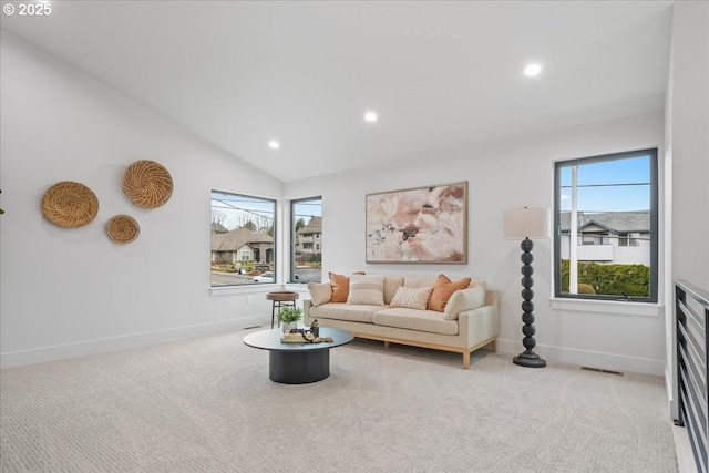 carpeted living room featuring recessed lighting, visible vents, and baseboards