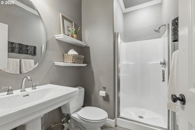 21163 SW Nursery Way, Sherwood, OR 97140 - full bathroom featuring a shower stall, a sink, toilet, crown molding, and a textured wall