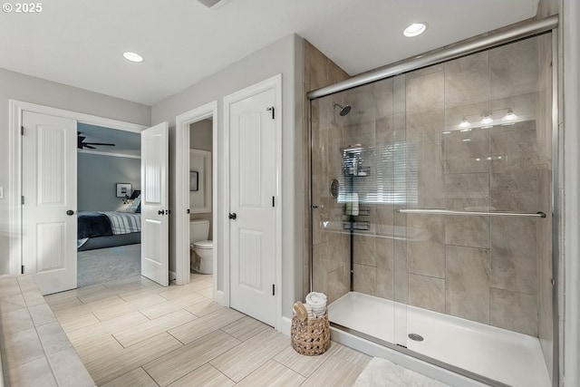 21163 SW Nursery Way, Sherwood, OR 97140 - full bathroom featuring toilet, a stall shower, ensuite bathroom, recessed lighting, and wood finish floors