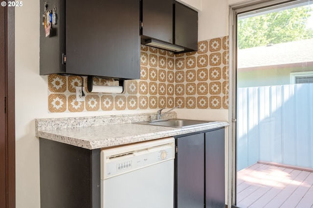 10904 SW 62nd Pl, Portland, OR 97219 - kitchen featuring white dishwasher, a sink, light countertops, and backsplash
