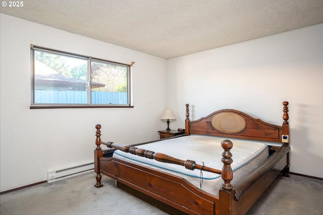 10904 SW 62nd Pl, Portland, OR 97219 - bedroom with baseboard heating, carpet, a textured ceiling, and baseboards