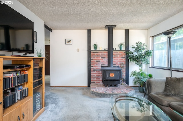 10904 SW 62nd Pl, Portland, OR 97219 - living room with carpet flooring, a wood stove, and a textured ceiling