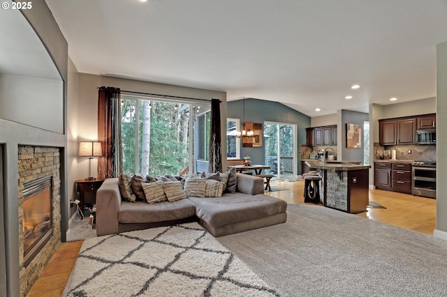 1044 N 26th Ter, Cornelius, OR 97113 - living area featuring a fireplace, healthy amount of natural light, a chandelier, and recessed lighting