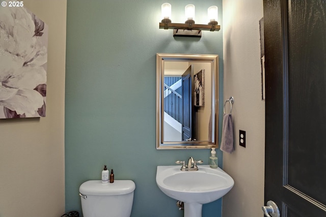 bathroom with sink and toilet