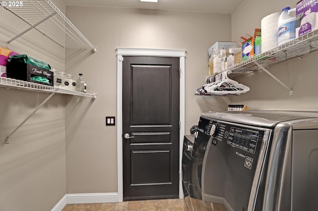 1044 N 26th Ter, Cornelius, OR 97113 - laundry area with washing machine and clothes dryer and baseboards