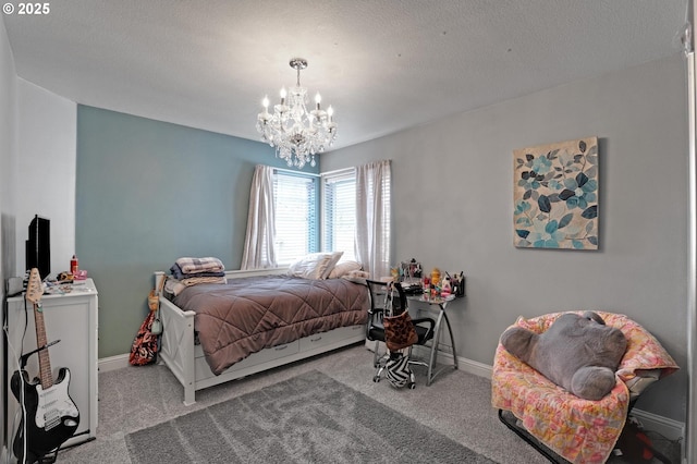 carpeted bedroom with a textured ceiling and a notable chandelier