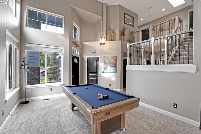 rec room with billiards, carpet floors, and a high ceiling