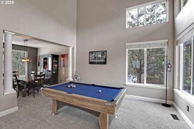 playroom with a towering ceiling, carpet floors, decorative columns, and billiards