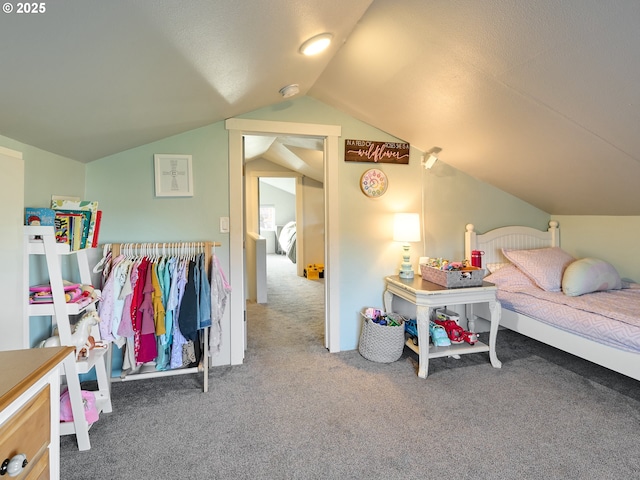 carpeted bedroom with vaulted ceiling