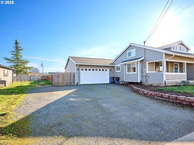 view of front of house featuring a garage and a porch