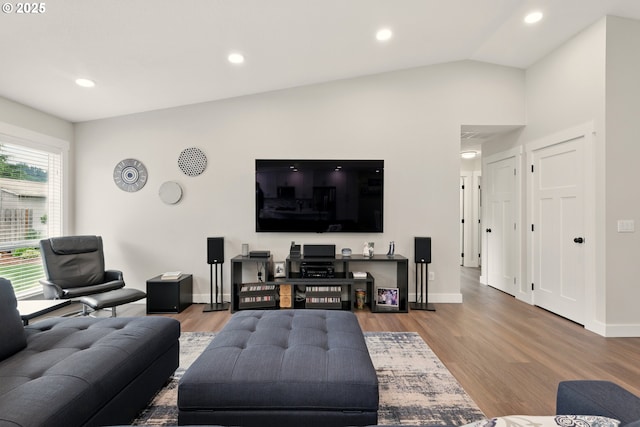 304 SW Birdsdale Dr, Gresham, OR 97080 - living room with recessed lighting, wood finished floors, baseboards, and lofted ceiling