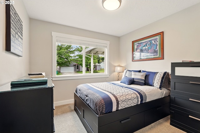 304 SW Birdsdale Dr, Gresham, OR 97080 - bedroom featuring light carpet and baseboards