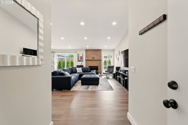 304 SW Birdsdale Dr, Gresham, OR 97080 - living room with a fireplace, wood finished floors, recessed lighting, and baseboards