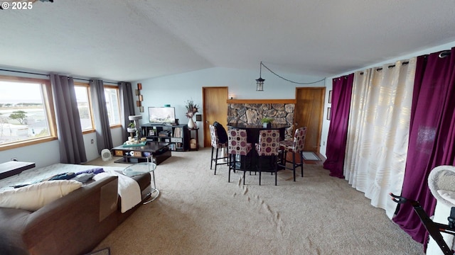 living room featuring lofted ceiling and light colored carpet