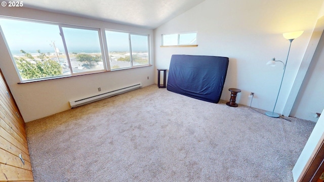 29730 Hillcrest St, Gold Beach, OR 97444 - spare room featuring a baseboard heating unit, vaulted ceiling, and carpet flooring