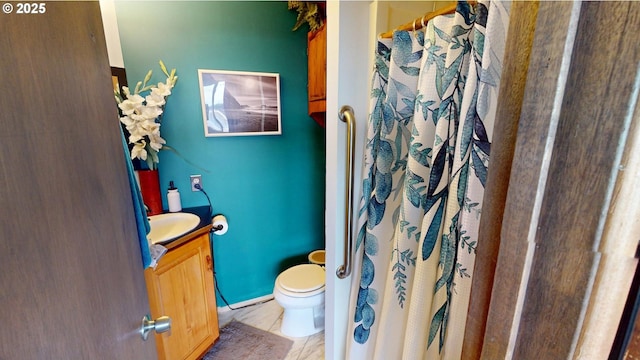 bathroom with vanity and toilet