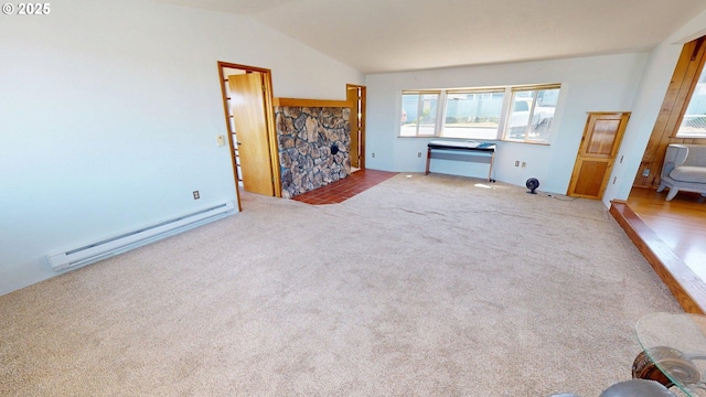 29730 Hillcrest St, Gold Beach, OR 97444 - unfurnished living room featuring a baseboard heating unit, carpet floors, and lofted ceiling