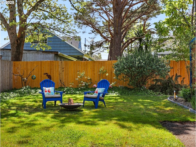 view of yard with a fire pit