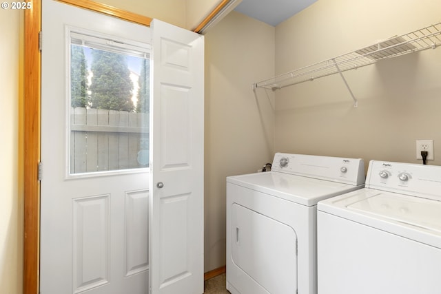 laundry area featuring laundry area and washer and clothes dryer