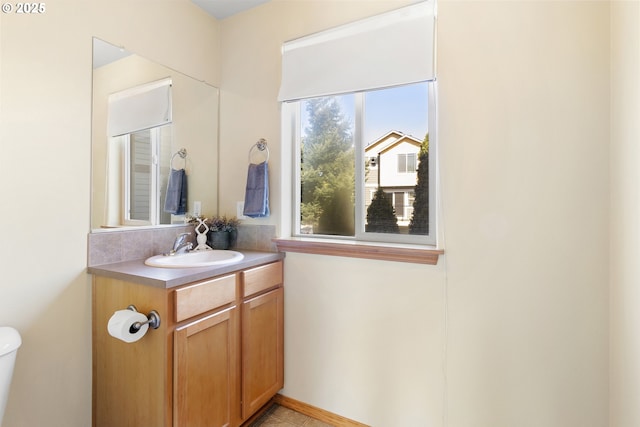 bathroom featuring vanity and toilet