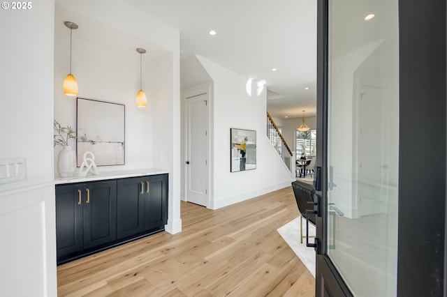 2258 Satter St, West Linn, OR 97068 - bar featuring light wood-style floors, stairway, baseboards, decorative light fixtures, and recessed lighting
