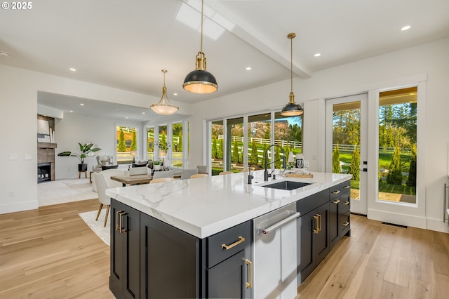 2258 Satter St, West Linn, OR 97068 - kitchen featuring a sink, healthy amount of natural light, light wood-style floors, stainless steel dishwasher, and recessed lighting