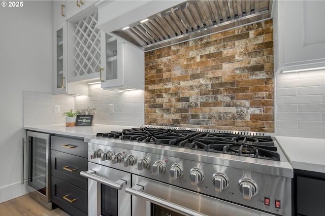 2258 Satter St, West Linn, OR 97068 - kitchen featuring wine cooler, high end range, custom range hood, and light countertops