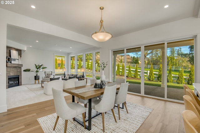 2258 Satter St, West Linn, OR 97068 - dining space with plenty of natural light, recessed lighting, a tile fireplace, and light wood-style flooring