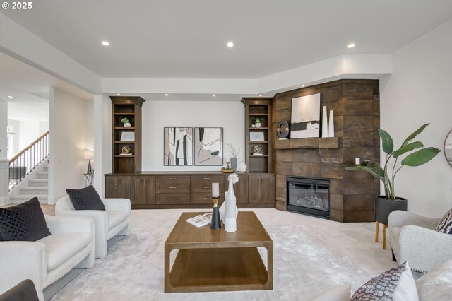 2258 Satter St, West Linn, OR 97068 - living room with a tiled fireplace, stairs, recessed lighting, and light carpet