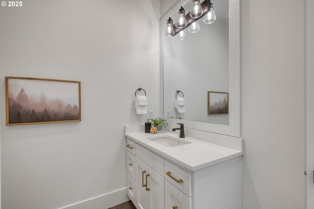bathroom featuring vanity and baseboards