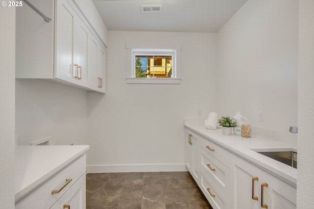 2258 Satter St, West Linn, OR 97068 - laundry room featuring cabinet space and baseboards