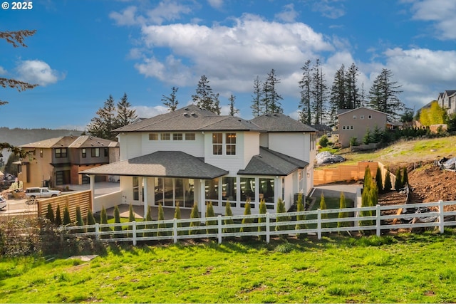 2258 Satter St, West Linn, OR 97068 - rear view of house with a sunroom, a fenced backyard, roof with shingles, and a residential view