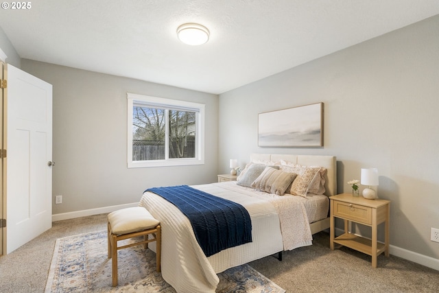 bedroom featuring baseboards and carpet floors