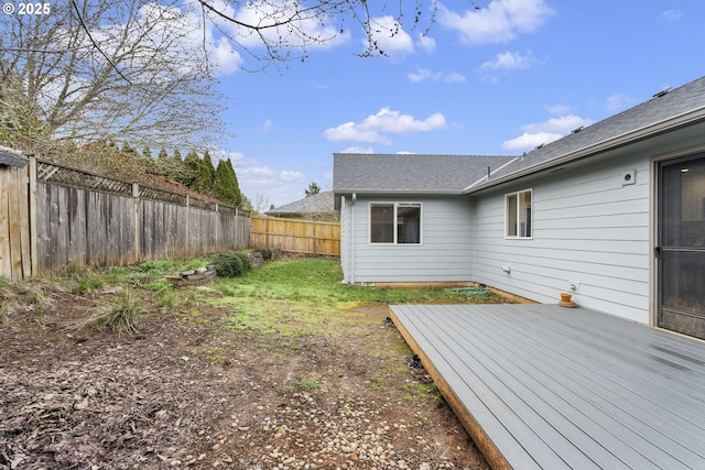 view of yard featuring a fenced backyard and a deck