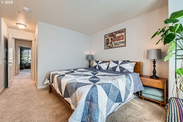 bedroom featuring baseboards and light carpet