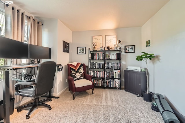 carpeted office featuring baseboards