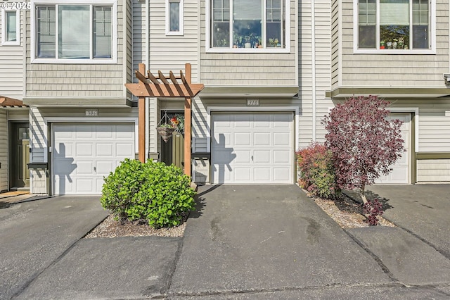 exterior space with driveway and a garage